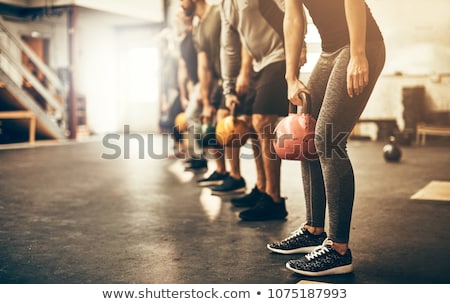 Stockfoto: Fitness Woman Working Out With Kettle Bell