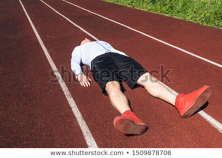Stock photo: Exhausted Sportsman Finished Running At The Stadium