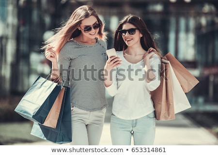 Stock fotó: Two Young Women Shopping In Mall