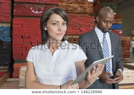 [[stock_photo]]: Two Men Holding Cell Phone Tablet Pc
