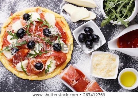 Foto stock: Italian Pizza With Mozzarella Prosciutto Tomatoes And Olives