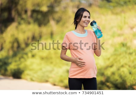 Foto d'archivio: Young Pregnant Woman In The Summer Park