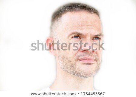 [[stock_photo]]: Portrait Of Masculine Serious Man 30s With Stubble In White Shir