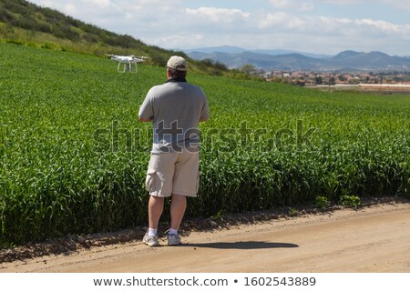 Stock photo: Uav Drone Pilot Flying And Gathering Data Over Country Farm Land