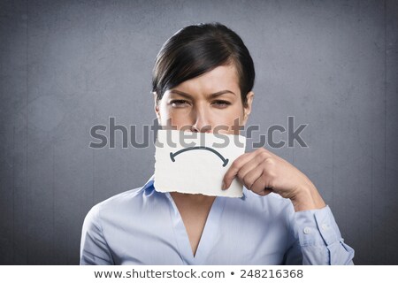 Stockfoto: Upset Businesswoman Holding Blank White Card In Front Of Her Mou