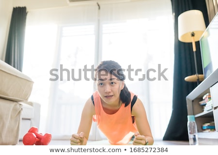 Foto stock: Asian Woman Working With Weights