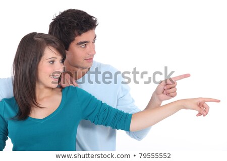 Foto d'archivio: Couple Stood Together Pointing Into The Distance