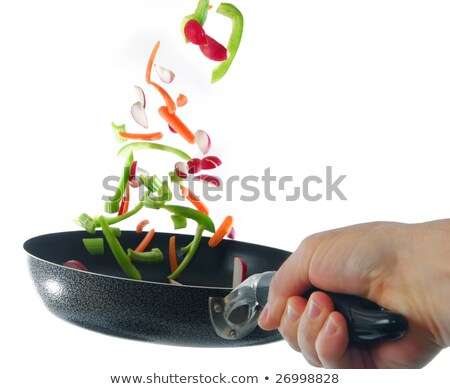 Stock photo: Flipping Veggies With Pan Studio Isolated