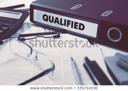 Stock photo: Qualified On Office Binder Toned Image