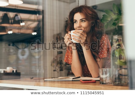 Stok fotoğraf: Woman Drinking Coffee At Cafe
