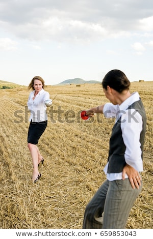 Stok fotoğraf: Businesspeople Fencing In A Wheat Field