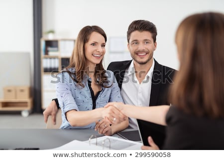 Foto stock: Notary And Client Shaking Hands In Office