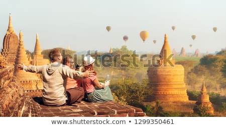 ストックフォト: Young Woman Tourist In Pagoda Travel To Asia Concept Traveling With A Baby Concept