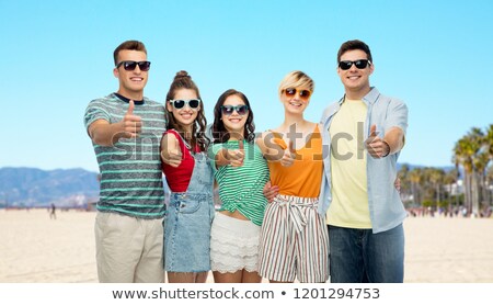 [[stock_photo]]: Happy Friends Showing Thumbs Up Over Venice Beach