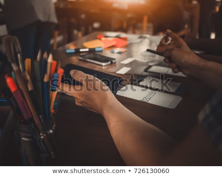 Foto stock: Ui Designer Calling On Smartphone At Office