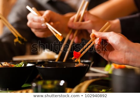 Man Eating Asian Food Foto d'archivio © Kzenon