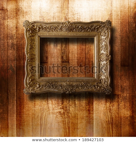 ストックフォト: Old Gilded Picture Frame For Portrait On The Scratched Wooden Wa