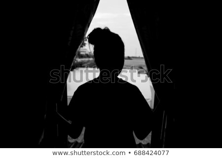 [[stock_photo]]: Young Couple Standing Outside A House In The Dark