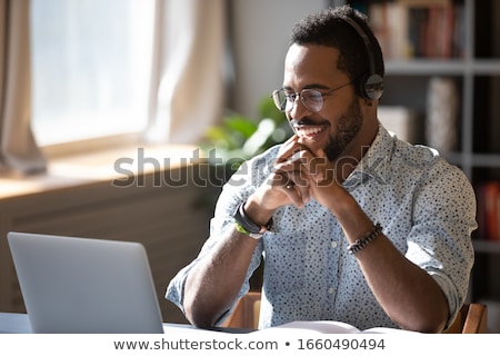 Foto stock: Corporate Business Man With Glasses Working Online On Computer