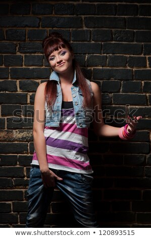 Stockfoto: Female Hip Hop Dance Leaning Against Wall