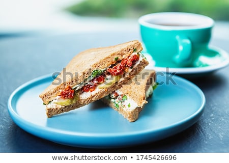 Foto stock: Bread Toast With Cheese Cucumber And Dried Tomato