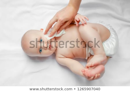 Stok fotoğraf: Mom Carefully Clean Baby Skin With Wet Wipes