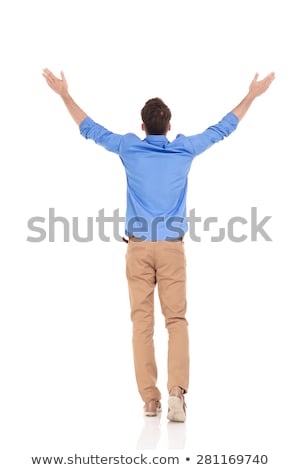 Stock fotó: Rear View Of Casual Man Celebrating And Stepping