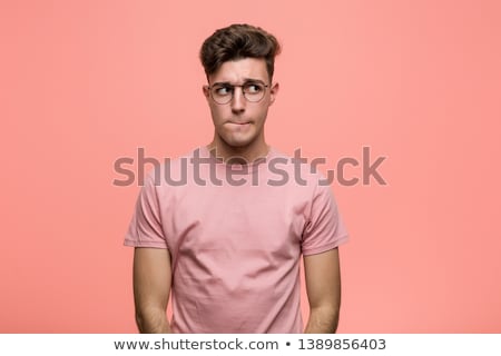 Сток-фото: Portrait Of A Confused Young Casual Man