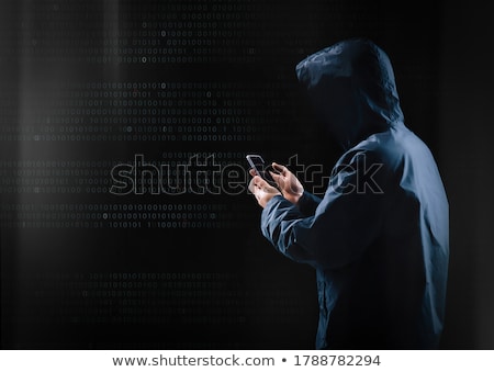 Stock fotó: Hacker With Smartphone And Computers In Dark Room