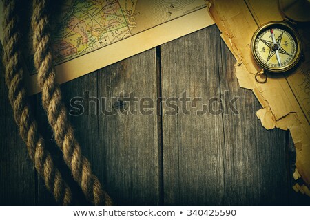 Сток-фото: Antique Brass Compass Over Old Map