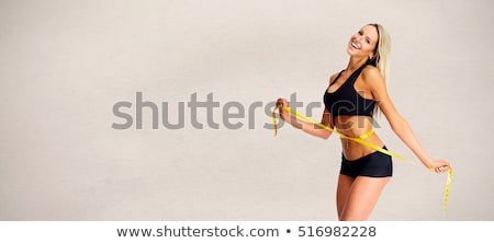 Stock photo: Girl With Tape Measure