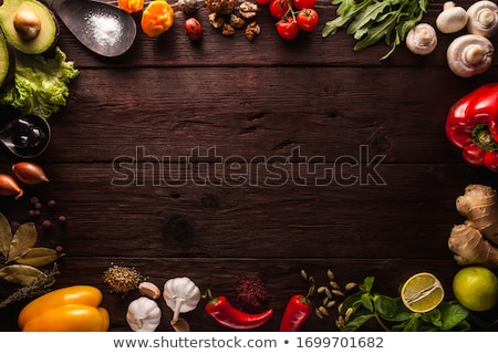 Stockfoto: Limes With Leaves On Brown Wooden Table