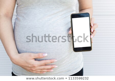 Stock fotó: Cropped Photo Of Pregnant Woman Showing Display