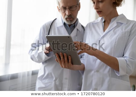 Foto stock: Woman Holding Digital Tablet Computer