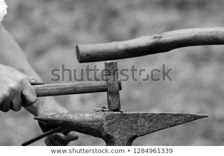 Stock fotó: Close Up Of Mans Hand Using A Rustic Hammer