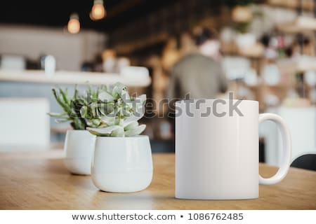 Stockfoto: White Mug Of Coffee On Table