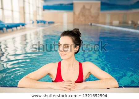 Foto stock: Serene Young Woman Having Rest By Poolside