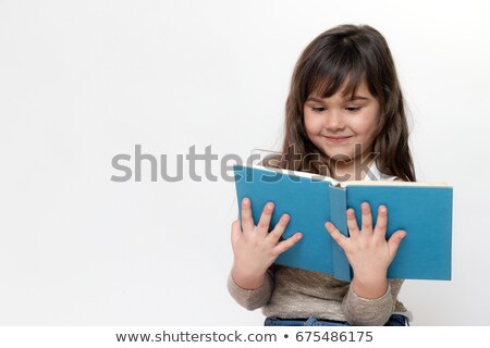 Front View Of Smiling Caucasian Schoolgirl Reading A Book In Library At Elementary School Сток-фото © Frank11