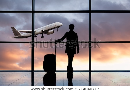 Foto stock: Aircraft With Reflection Of Sunset In Window And Body