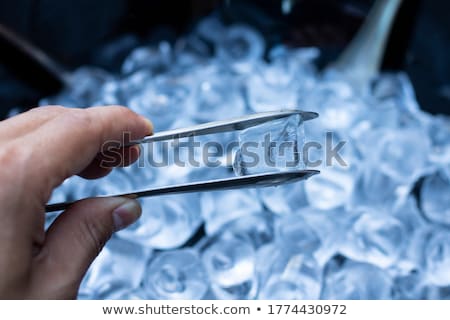 Stock photo: Cold Melting Ice Cubes With Water Drops On Blured Background