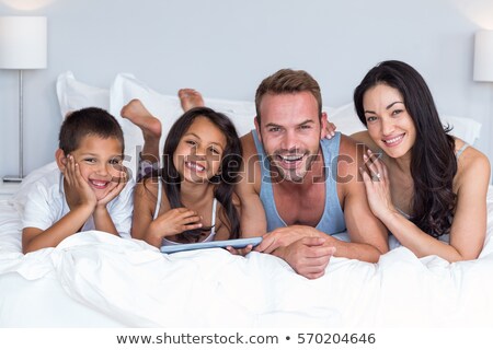 Stockfoto: Happy Mixed Race Family Portrait In Front Of Their House