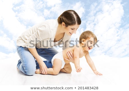 Stock fotó: Mother With Baby Over Sky Background