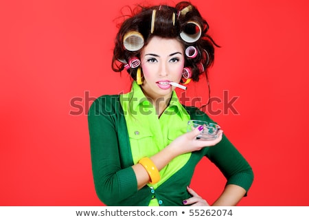 Stok fotoğraf: Funny Young Woman Housewife With Cigarette