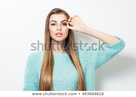 Foto stock: Teenage Girl Applying Eyeliner