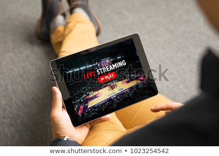 Сток-фото: Man Watching Live Sports On Digital Tablet