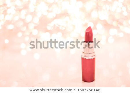 Foto stock: Coral Lipstick On Rose Gold Christmas New Years And Valentines