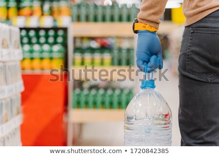 Stock foto: Panic Shopping During Coronavirus Pandemic Unrecognizable Man Shopper Wears Rubber Gloves Carries