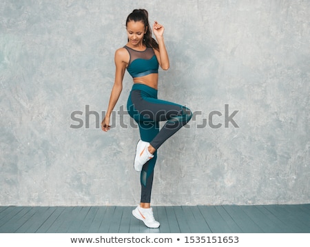 Stock fotó: Young Fit Woman With Perfect Body In Sports Clothing Jumping