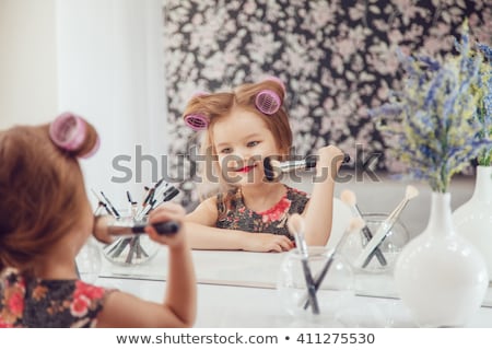 ストックフォト: Cute Little Girl Is Applying Mascara