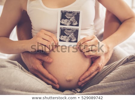 Foto stock: Happy Pregnant Female With Sonogram